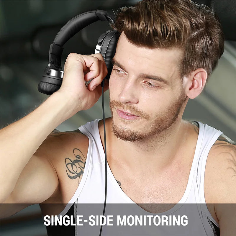 Man wearing black, wired over-ear studio monitor headphones with a comfortable, cushioned headband and earcups.