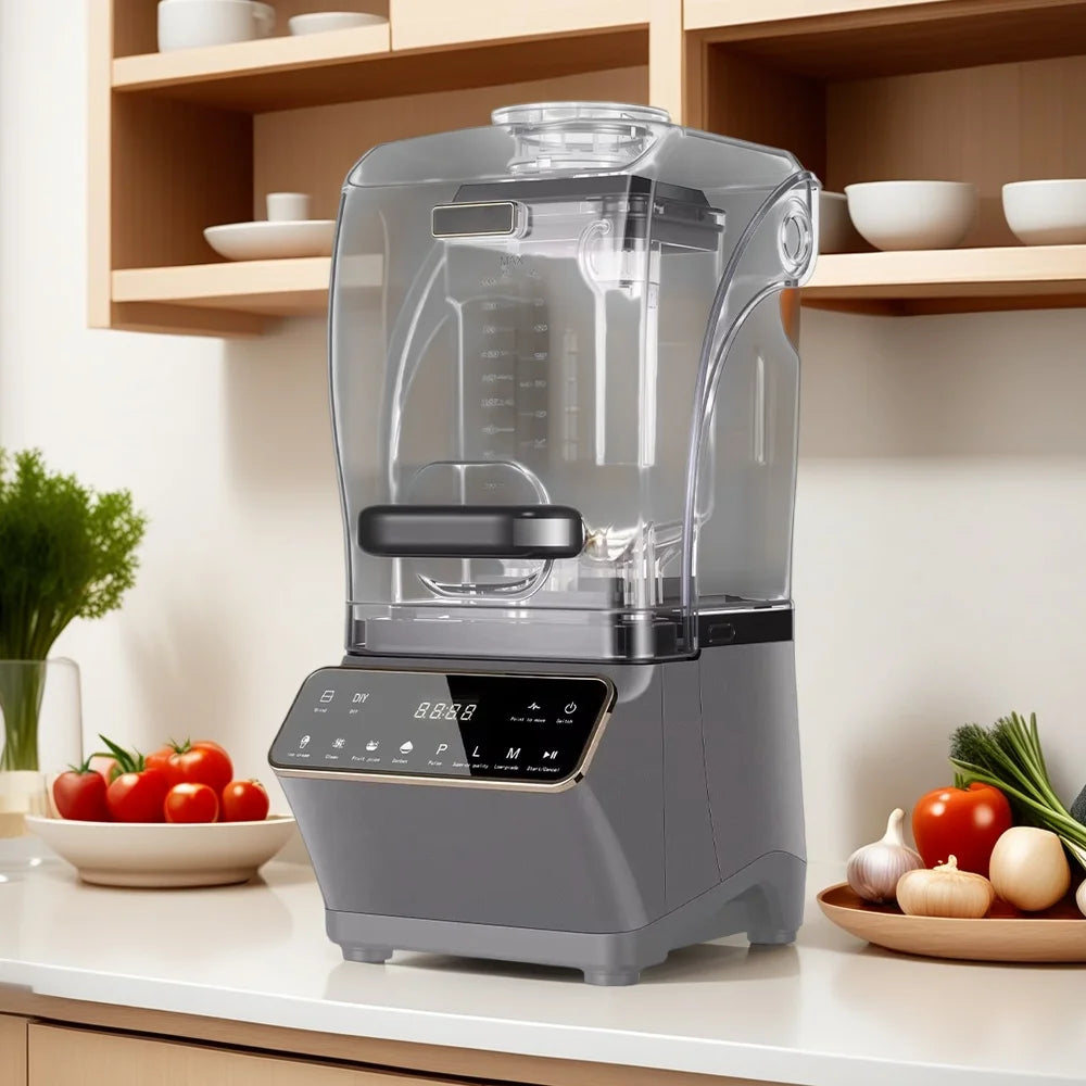 A grey countertop blender with a transparent sound-dampening enclosure and a digital touchscreen control panel.