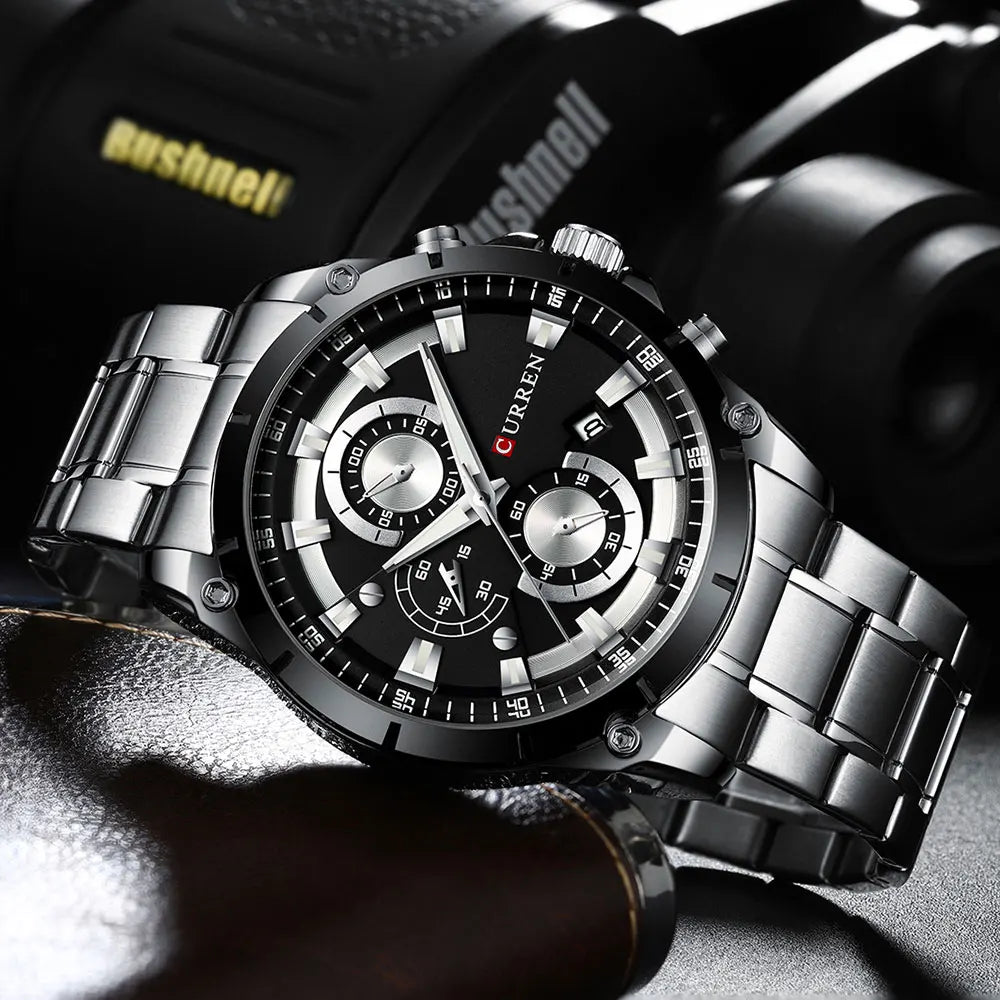 Men’s luxury stainless steel watch with a black multi-dial face, date display, and silver-tone link bracelet.