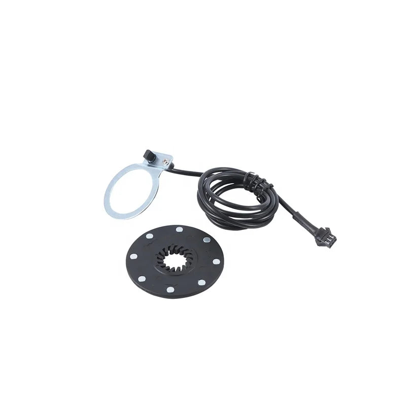 Electric bike pedal assist sensor (PAS) with a magnetic disc, mounting bracket, and wired connector on a white background.