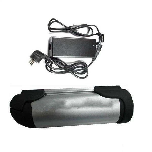 Silver cylindrical e-bike battery with black end caps and a matching black power adapter with a UK plug.