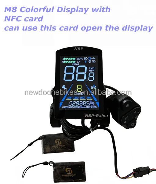 E-bike M8 colour display with wired control pad and two NFC unlocking cards against a plain white background.