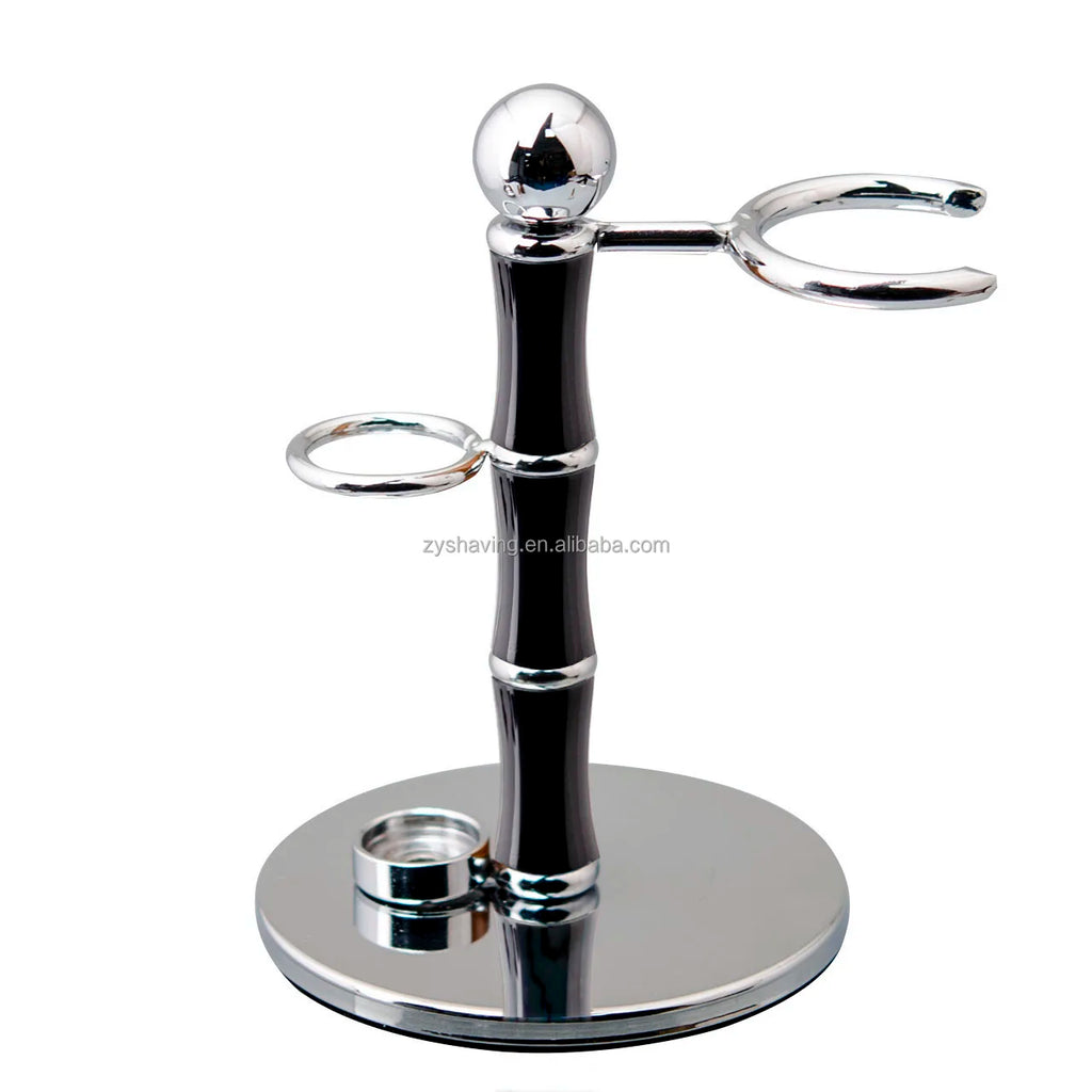 Luxury chrome and black shaving stand with holder for a razor and brush on a circular polished base.