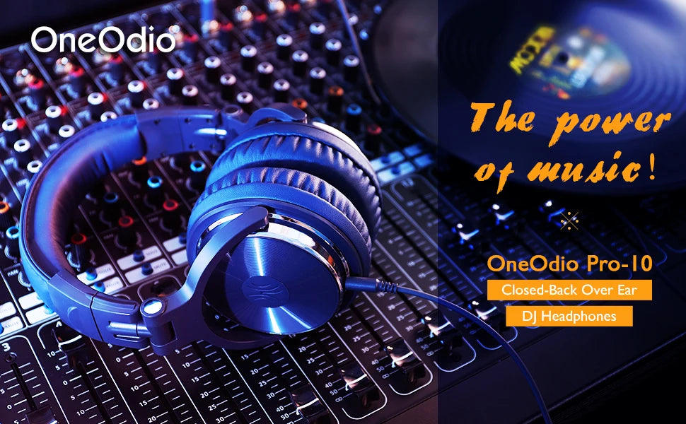 Black, closed-back professional wired DJ headphones with cushioned ear pads resting on a music mixing console.