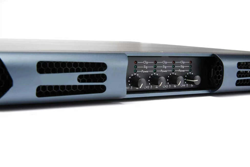 Grey 4-channel power amplifier with control dials and signal status LEDs, featuring a sleek, ventilated metal casing.