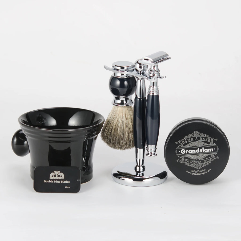 A traditional black and chrome shaving set featuring a double-edge razor, badger hair brush, bowl, soap, and blades.