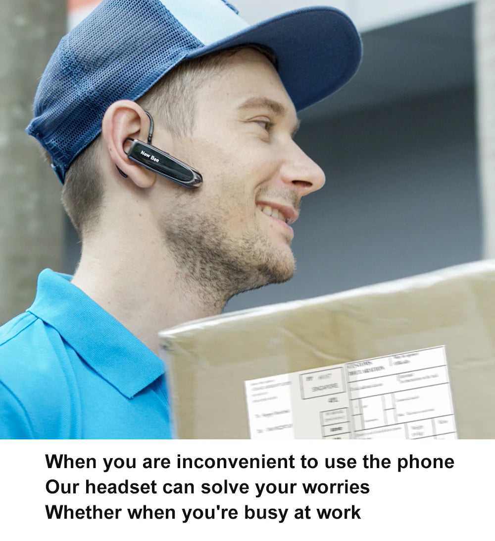 A man wearing a sleek, black wireless Bluetooth headset on his ear while carrying a parcel.