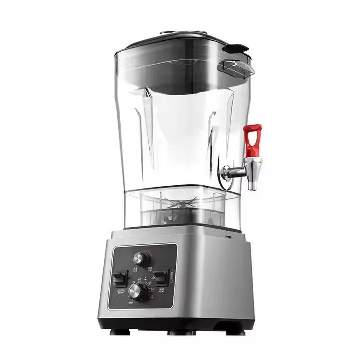Commercial blender with a clear pitcher, built-in red tap, and a silver metallic base with black control dials.
