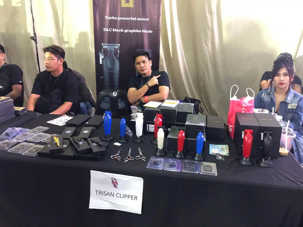 Professional cordless hair clippers and trimmers in red, blue, white, and black, displayed with stands and accessories.