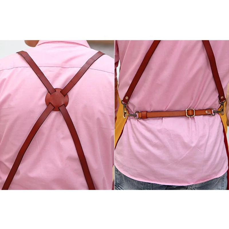 Back view of a yellow canvas apron with adjustable brown leather-look criss-cross straps and metallic buckles.