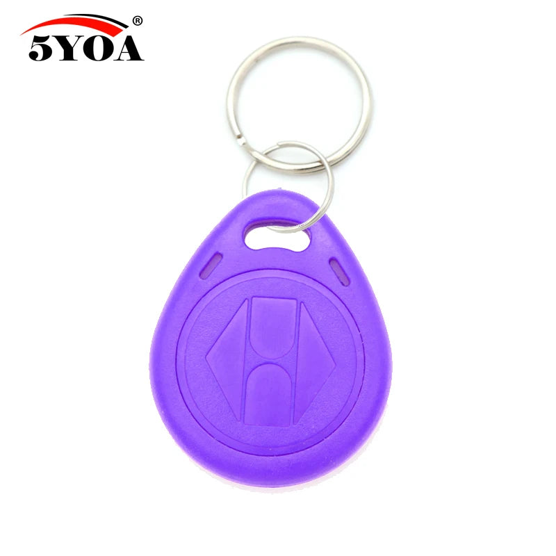 Purple teardrop-shaped plastic RFID key fob with a metal ring, featuring an embossed logo on a white background.