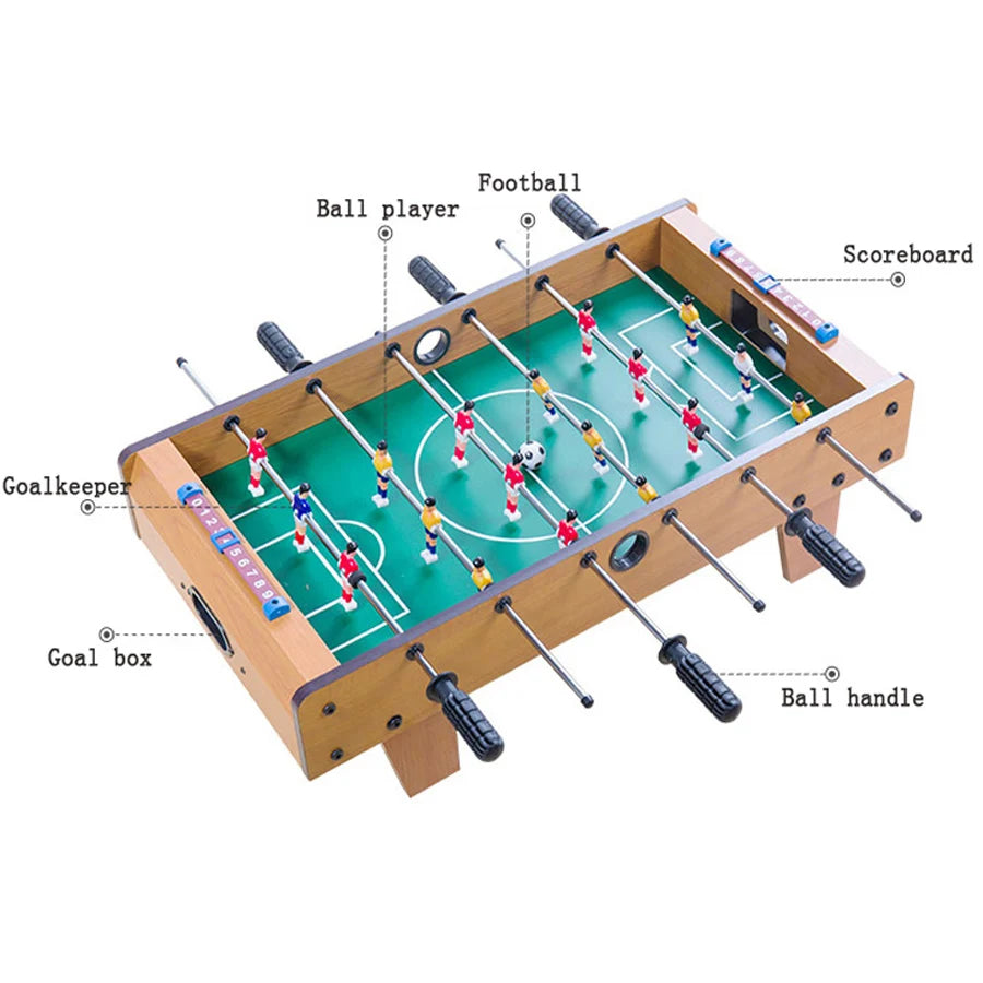 Wooden tabletop foosball table with green pitch, sliding scoreboards, black handles, and red and blue team players.