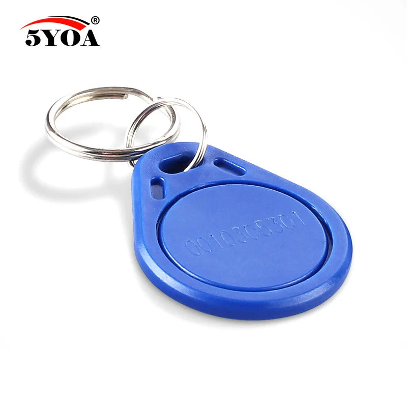 Blue plastic RFID key fob with a metal ring and an engraved identification number on a white background.