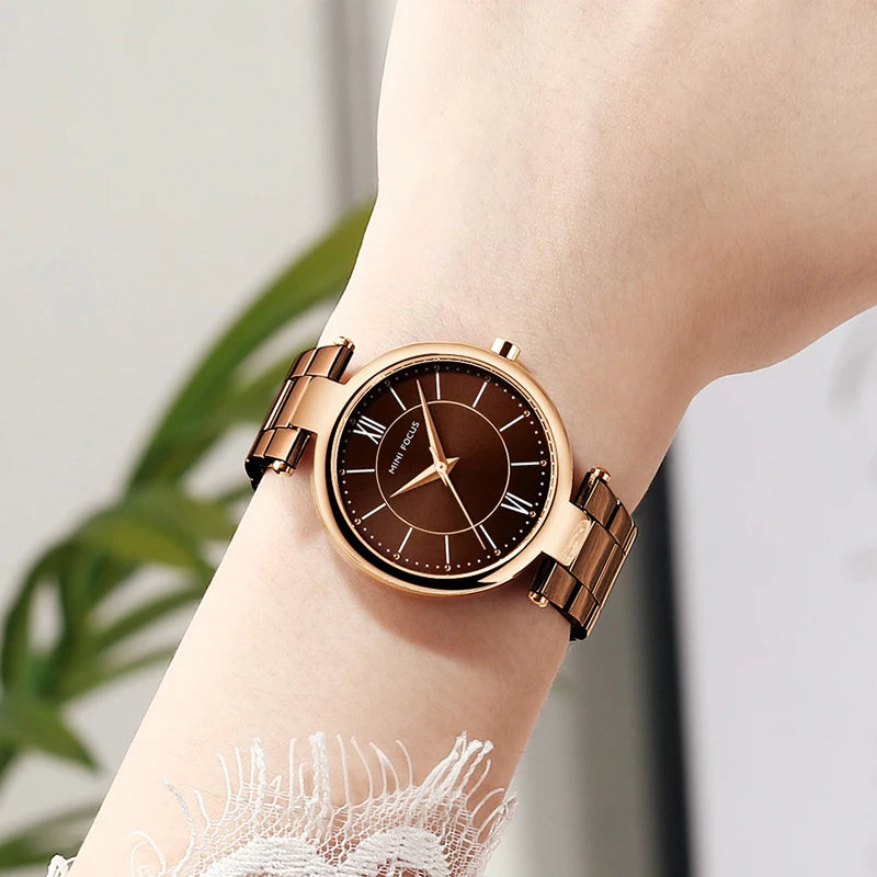 MINI FOCUS women's quartz watch with a round coffee brown dial, rose gold case, and matching stainless steel strap.