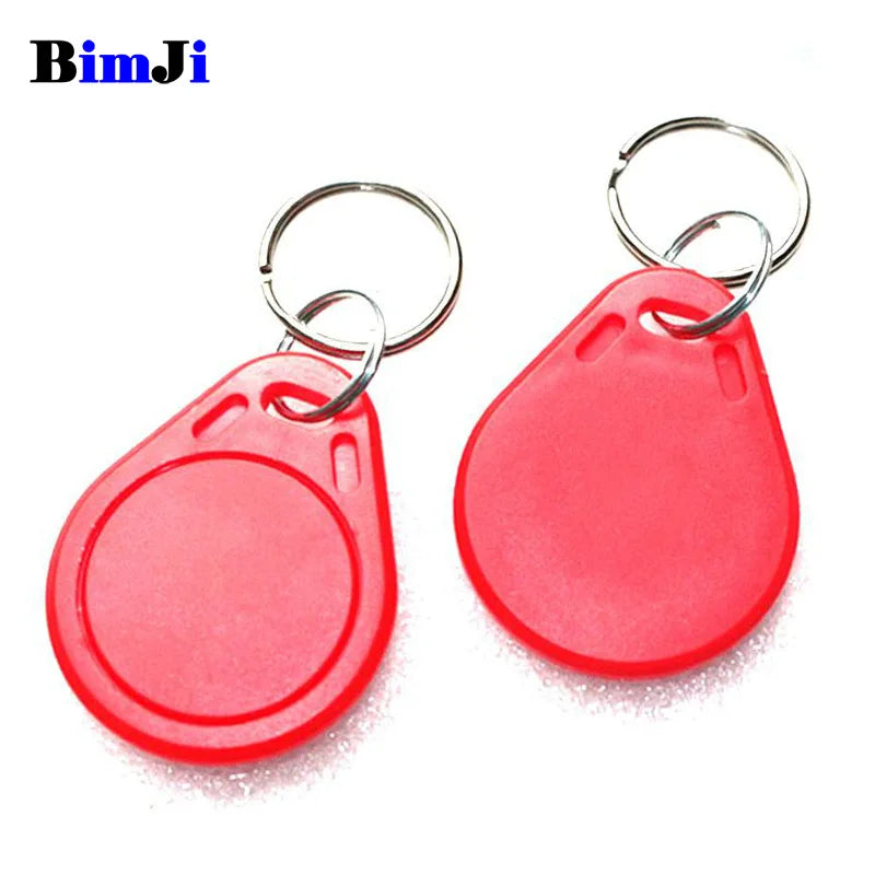 Two red plastic RFID key fobs, each with a silver metal split keyring for attachment.