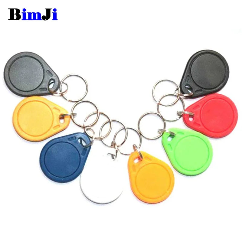 Multicolor plastic RFID key fobs with metal rings for keychains.