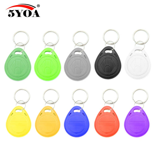 Ten colorful plastic RFID key fobs with metal keyring attachments in a grid layout on a white background.