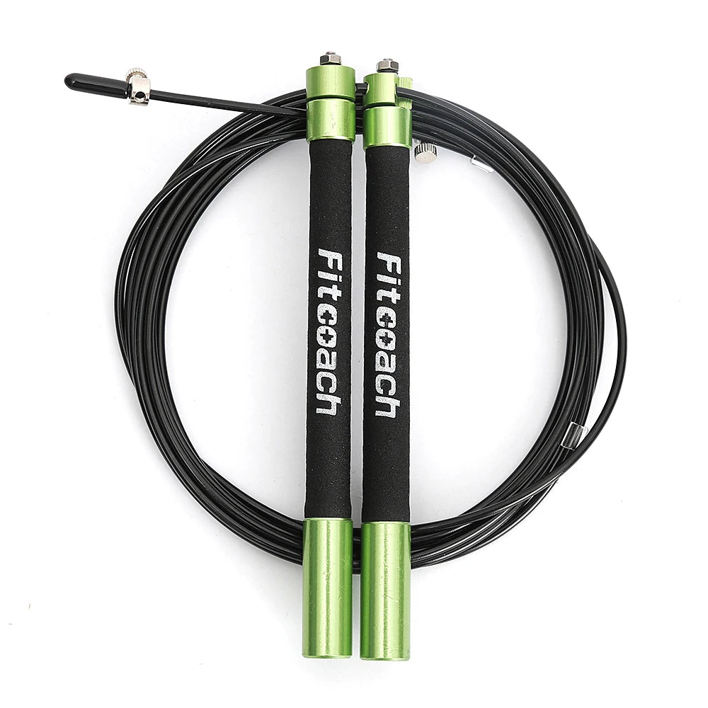 Black speed jump rope with green metal handles, coiled black cable, and white Fitcoach branding.