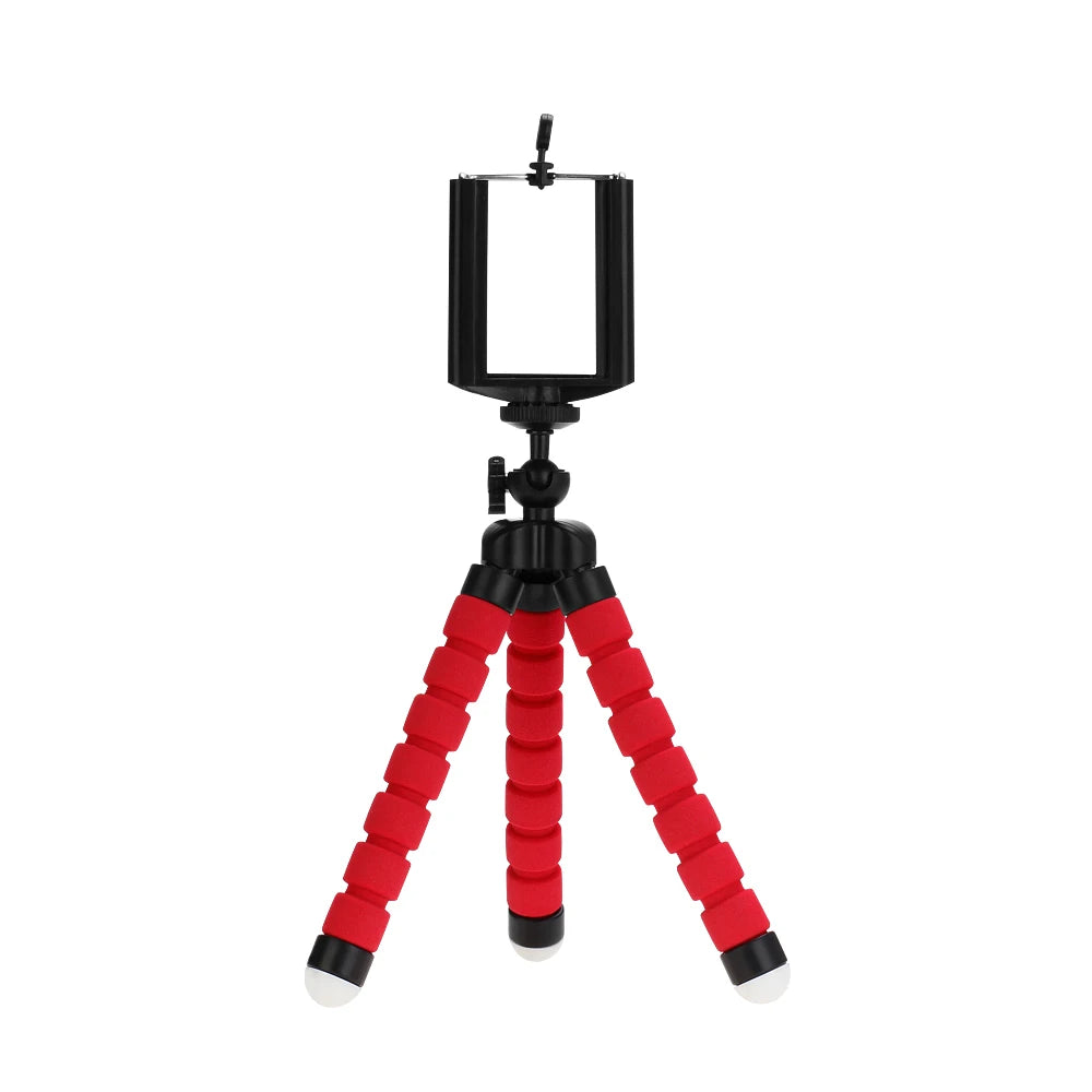 Flexible red and black tabletop tripod for smartphones with a universal adjustable mount and non-slip feet.