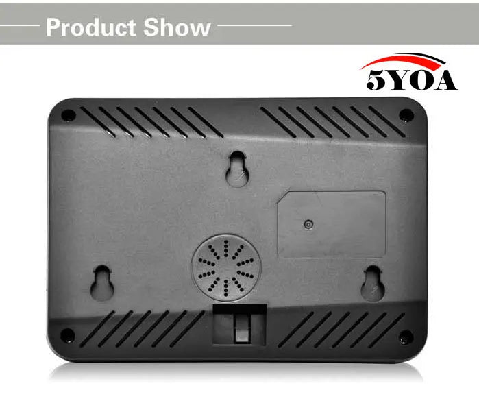 Back of a black plastic rectangular electronic device with wall mounting keyholes, speaker vent, and port openings.