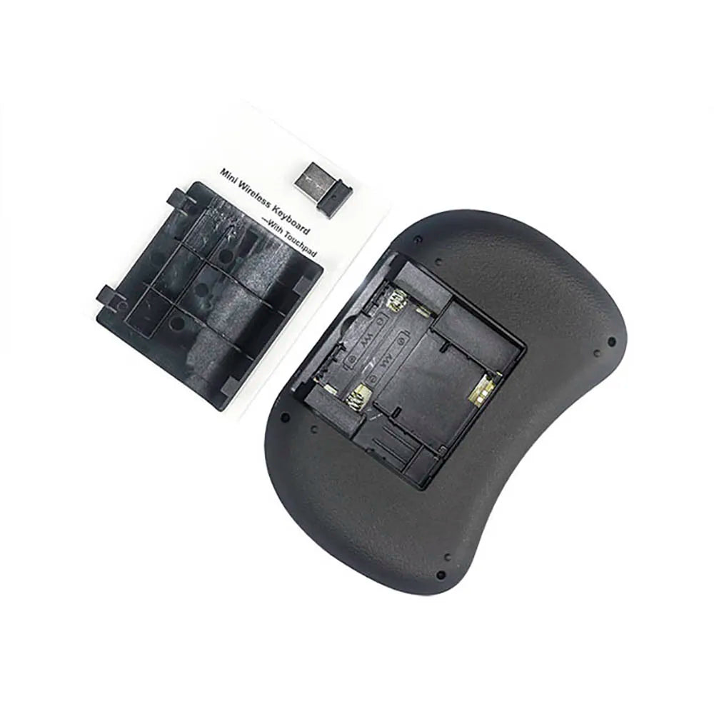 Black wireless mini keyboard with back cover removed to show battery compartment, plus a small USB receiver.