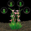 Artificial aquarium plant with bright green grass and pink flowers, surrounded by four small inset images of other plants.