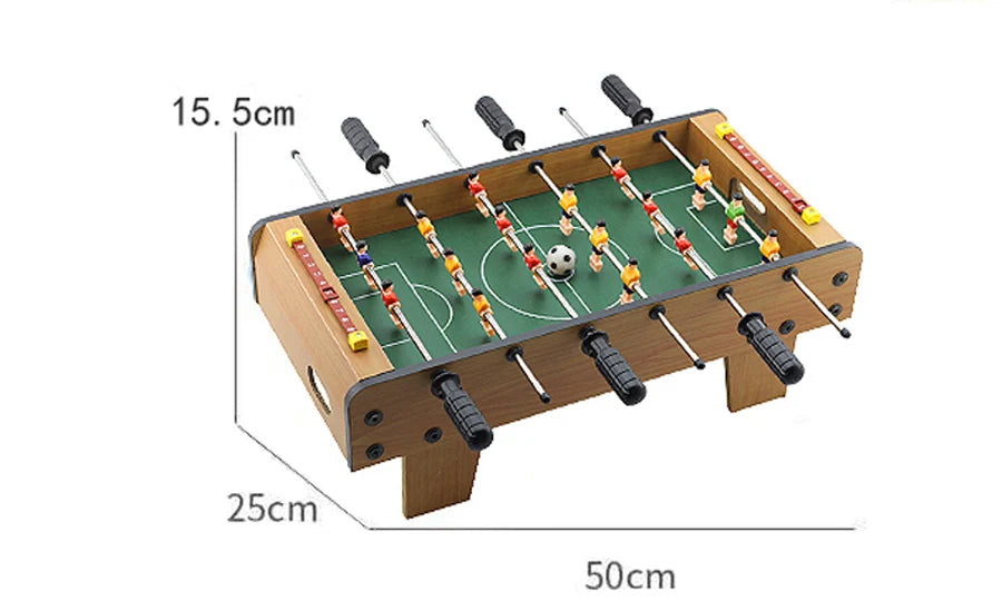 Tabletop foosball game with wood-effect finish, green pitch, ball, and score counters. Measures 50cm x 25cm x 15.5cm.