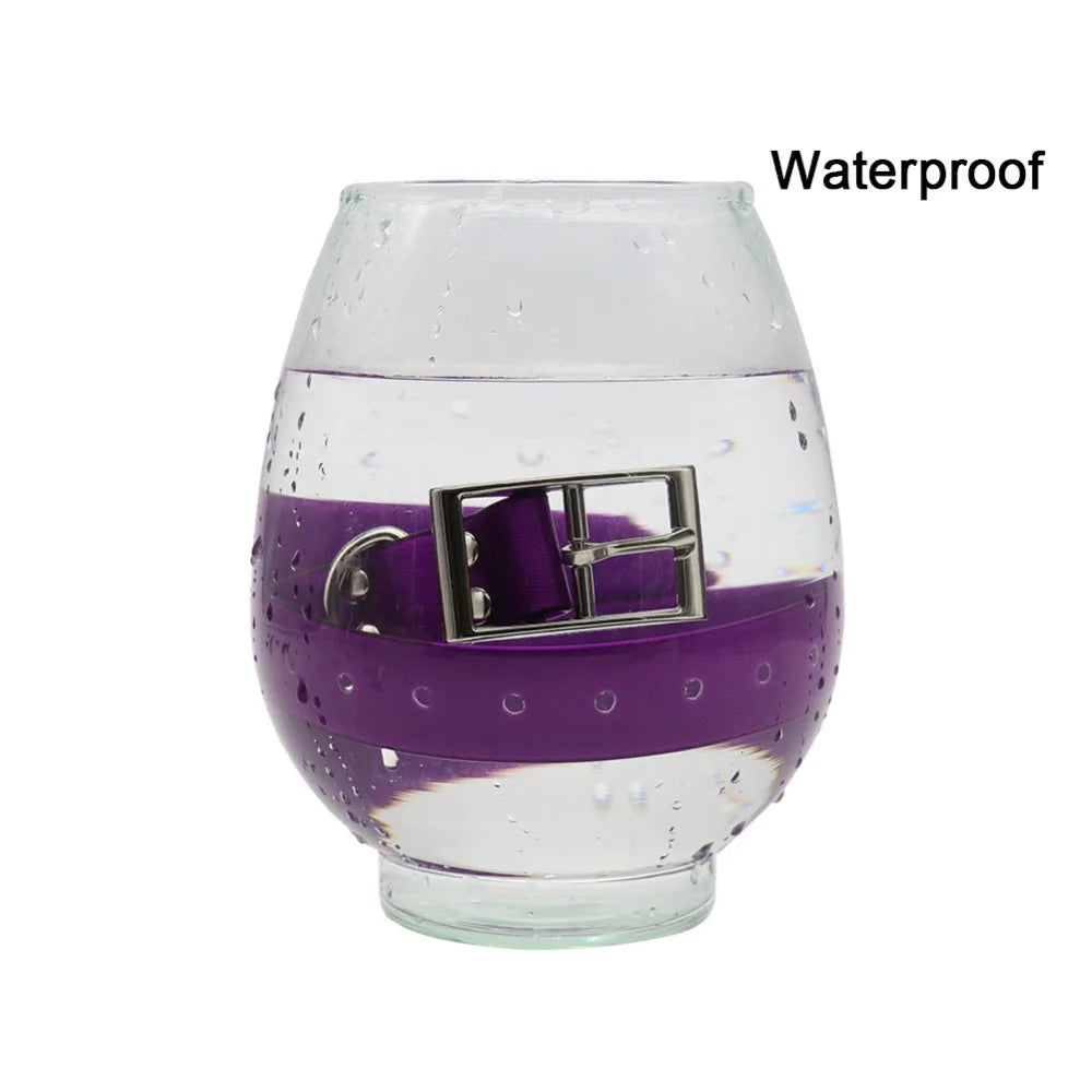 Purple waterproof reflective dog collar with a silver metal buckle, submerged inside a glass bowl of water.