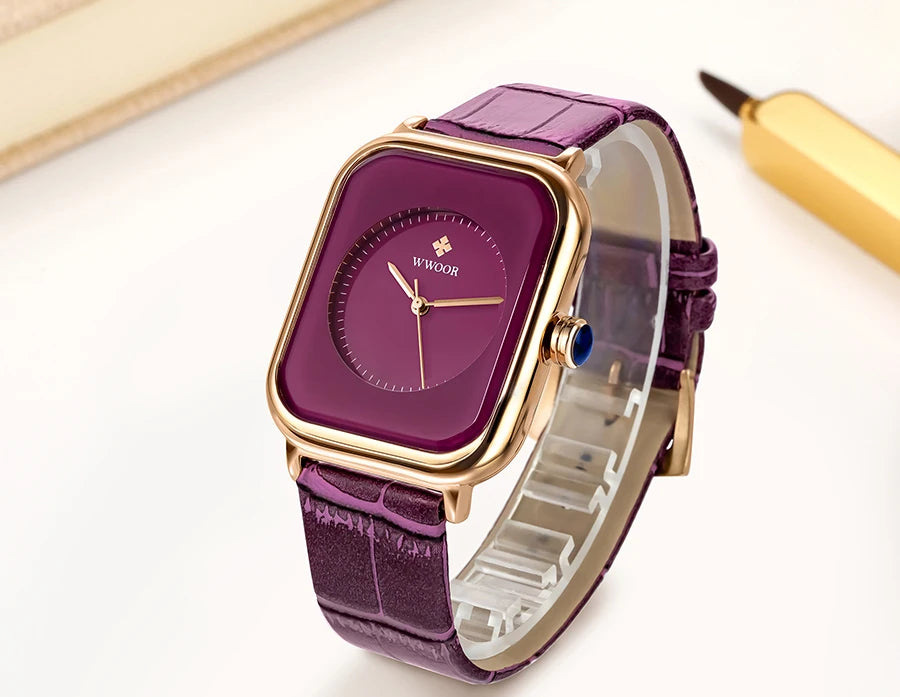 Elegant ladies' watch with a square plum dial, gold-tone case, and textured purple leather strap.