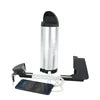 Silver cylindrical battery pack with black end caps, including charging cable and black mount.