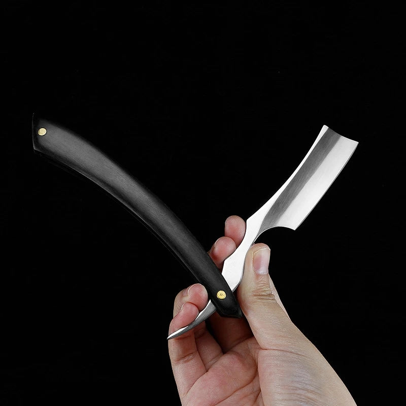 Professional stainless steel straight edge barber razor with a sleek matte black handle against a black background.
