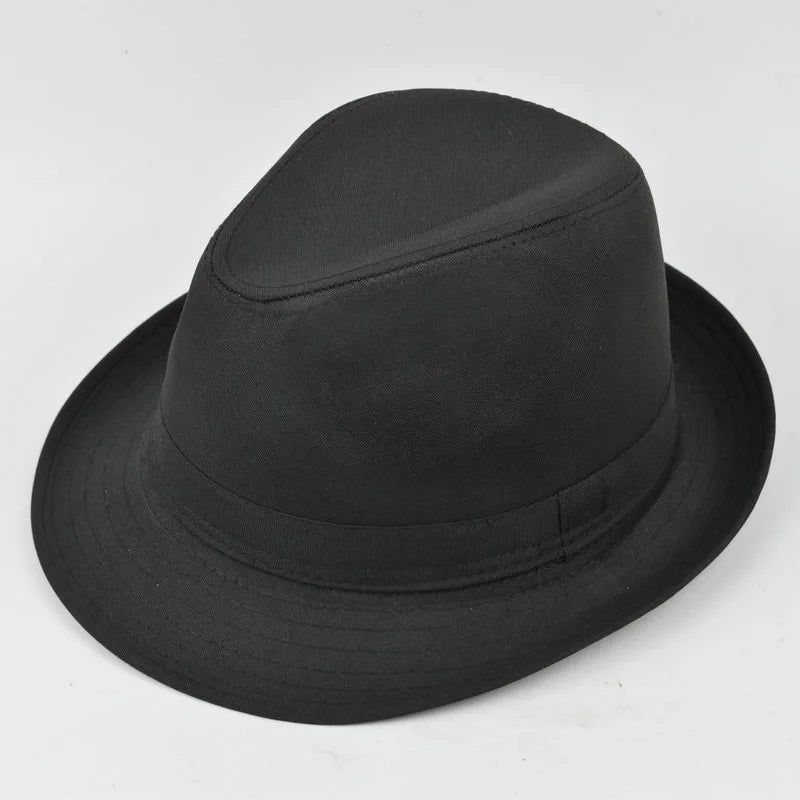 A classic solid black fedora hat with a structured crown and stitched brim detail, set against a white background.