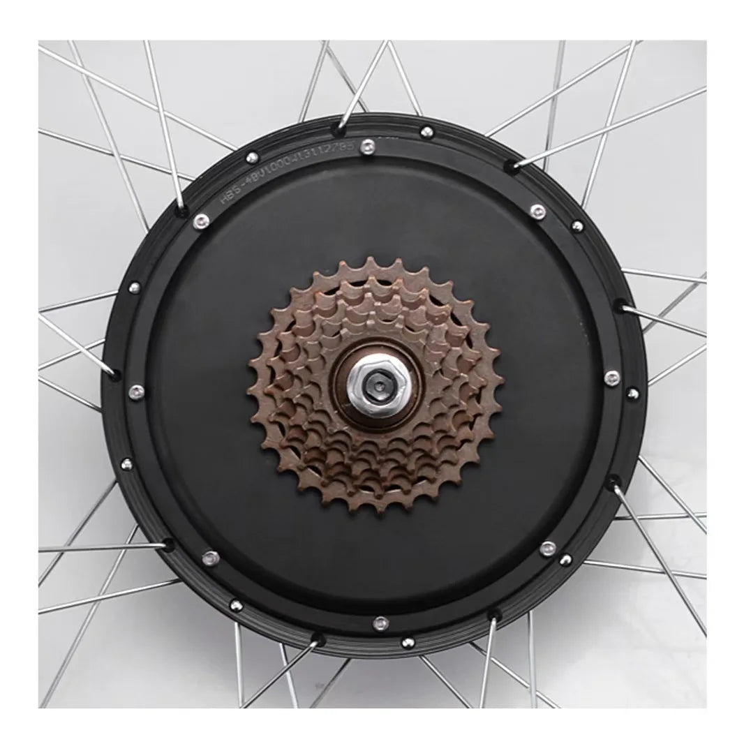 Black electric bike hub motor wheel with a multi-speed brown cassette gear cluster and silver spokes.