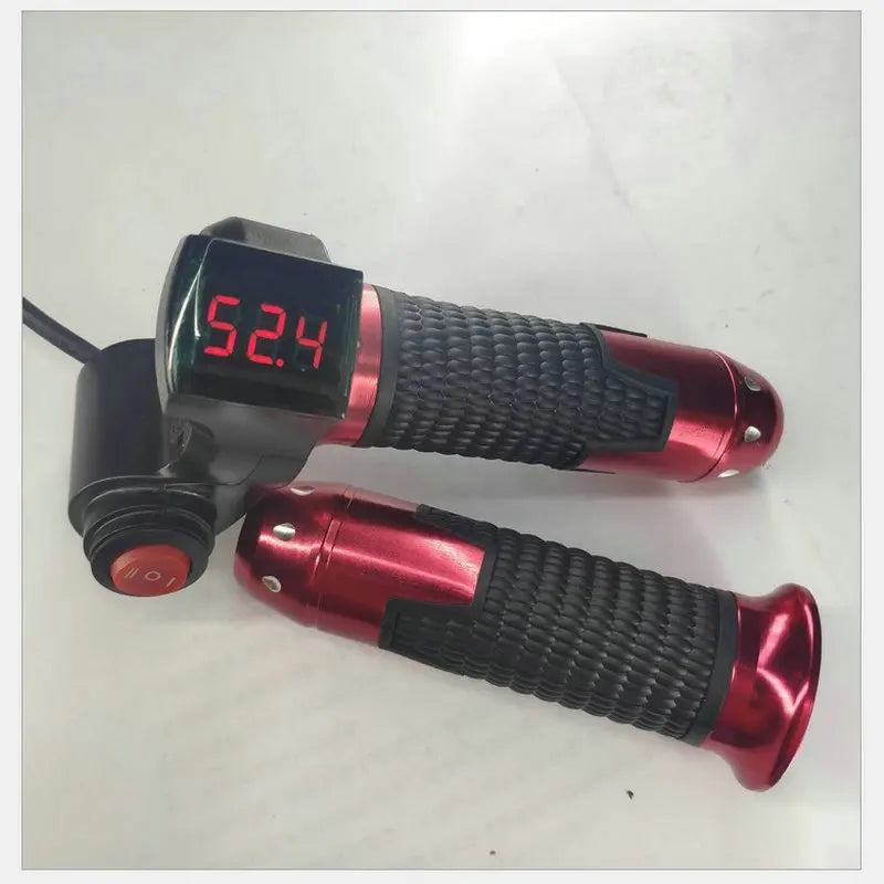 Red and black electric bike twist throttle with a built-in LCD voltage display and a red power switch.