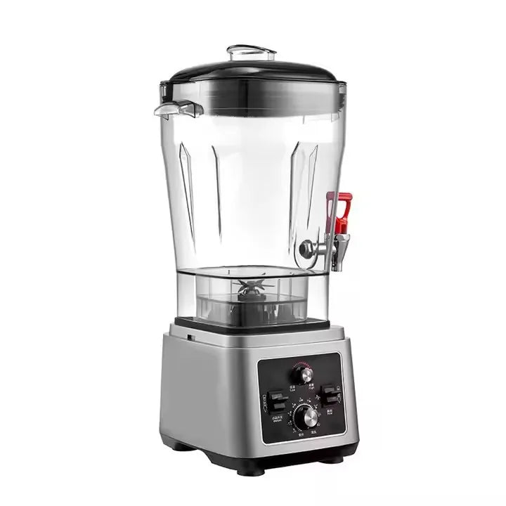 Silver industrial blender with a large clear container, dispensing tap, and manual dial controls on the base.