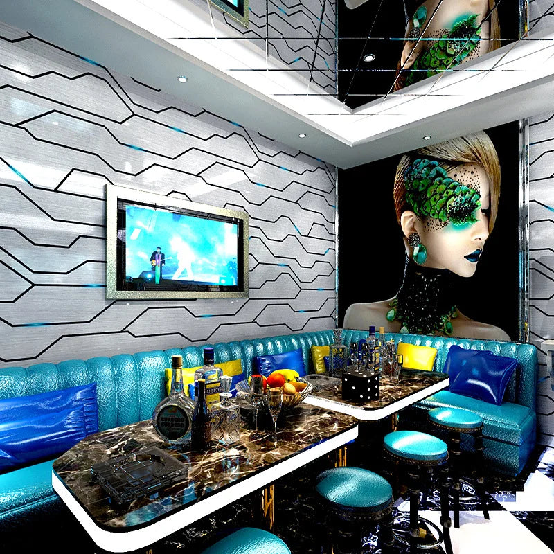 Modern feature wall wallpaper with reflective silver geometric lines and a vibrant fashion portrait accent panel.