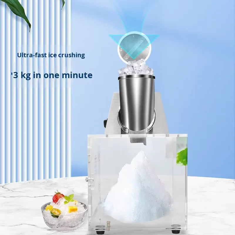 Electric ice crusher with a stainless steel hopper and transparent acrylic container, showing shaved ice inside.