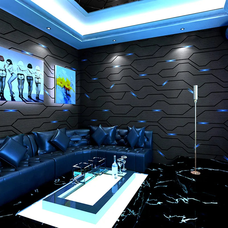 Modern black 3D wallpaper with geometric lines and blue reflective accents, styled in a luxurious lounge setting.