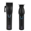 Set of two rechargeable black electric hair trimmers with digital battery displays and metallic blades.
