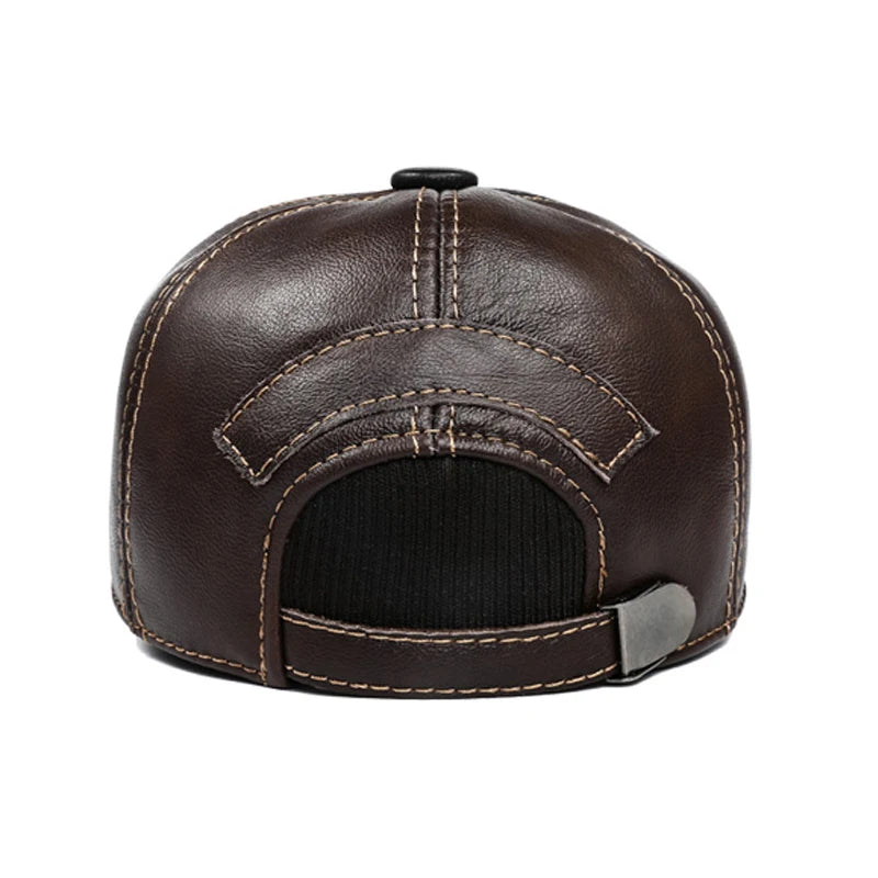 Back view of a brown leather baseball cap with stitched detailing, a black ear flap and an adjustable metal buckle.
