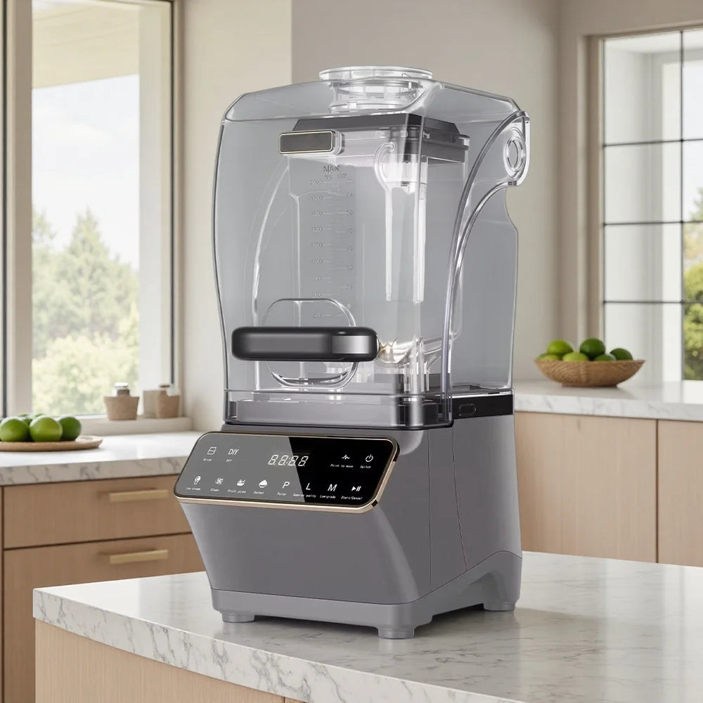 A modern grey professional countertop blender with a clear, sound-dampening enclosure and a digital touchscreen base.