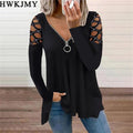 Black long-sleeve top with a zip-up V-neck and decorative cut-out lattice detailing on the shoulders.