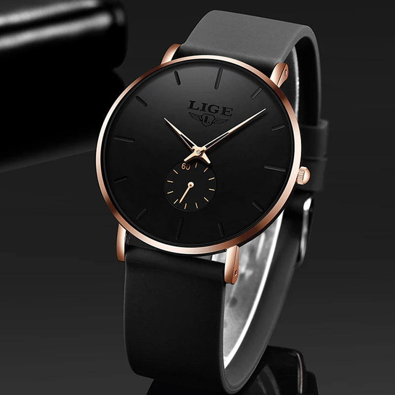 LIGE ultra-thin men's quartz watch with a round black dial, rose gold bezel, and a black silicone strap.