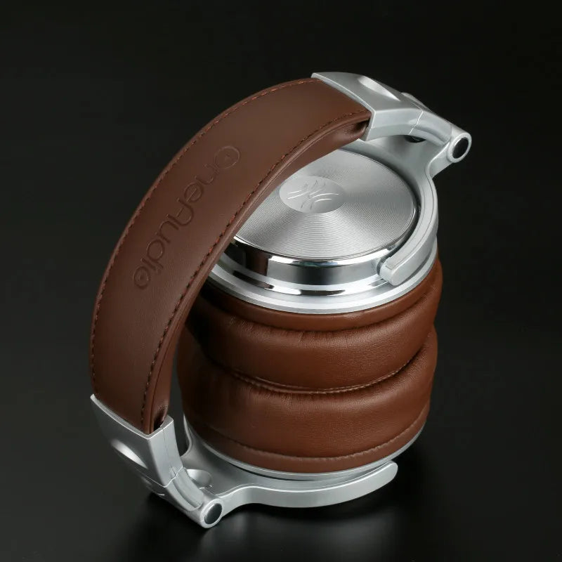Brown and silver foldable over-ear studio headphones with plush cushioned ear pads on a black background.