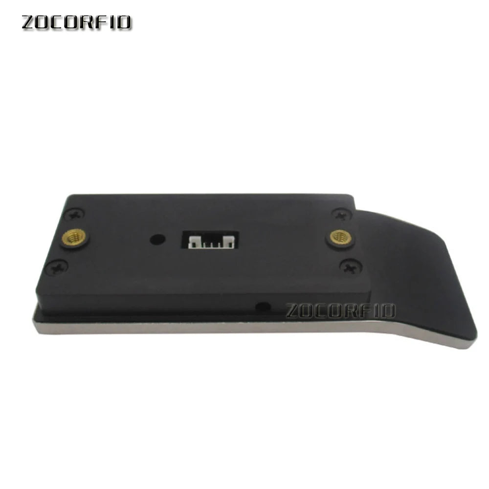 Black plastic electronic component with metal base, internal connector, screw mountings, and a flat extending arm.