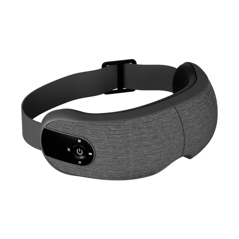 Grey heated eye massager with an adjustable strap, control panel, and integrated music and compression features.