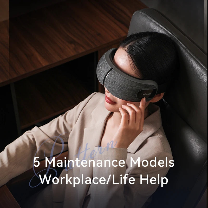 A woman wearing a sleek, grey fabric smart eye compression massager while relaxing in an office chair.