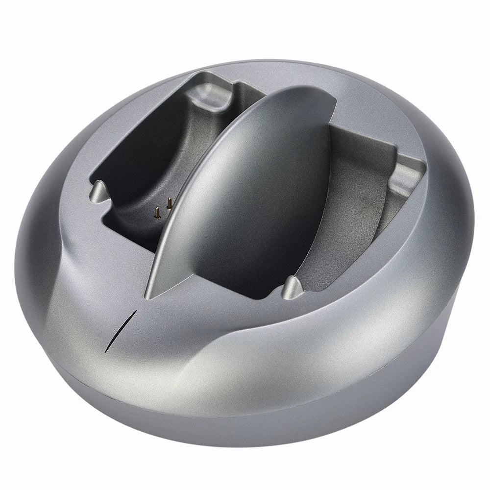 Round, metallic grey wireless TV headphone transmitter and charging base with an internal charging contact point.