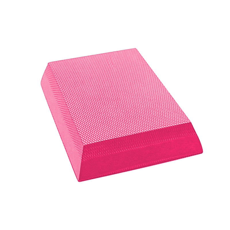 Bright pink rectangular TPE foam balance pad with a textured, non-slip diamond pattern surface.