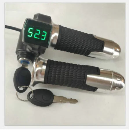 Black and silver electric bike twist throttle with a green LED digital voltage display and a security key ignition.